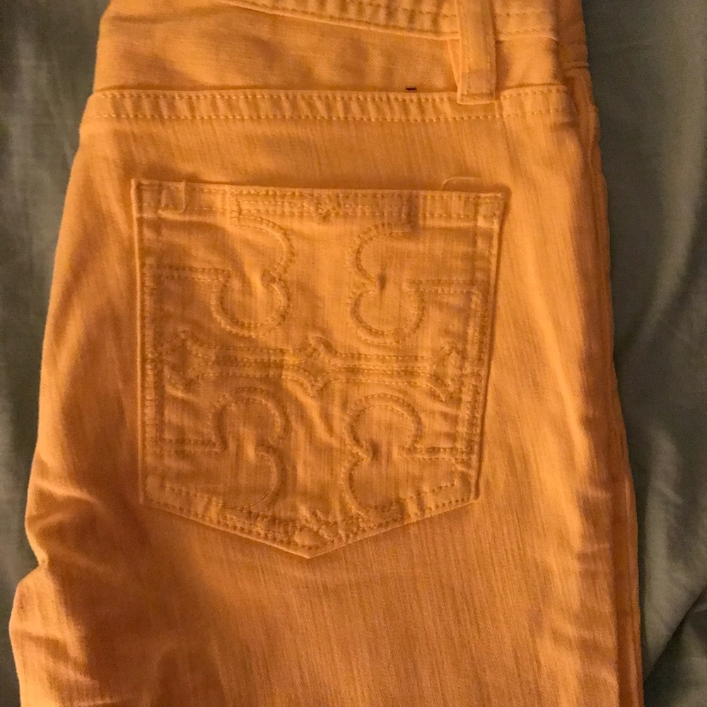 Tory Burch yellow cropped slim boot cut jeans
